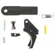 Curved black polymer trigger, three springs, two small steel parts, a yellow slave pin, and Apex sight tool
