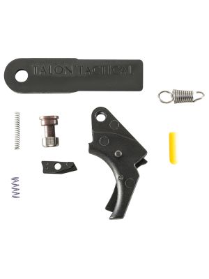 Curved black polymer trigger, three springs, two small steel parts, a yellow slave pin, and Apex sight tool